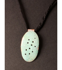 Pierced  and enamelled copper oval 