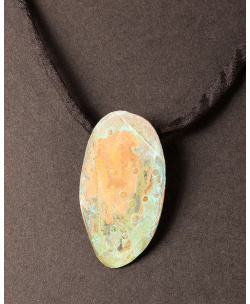 Textured copper oval with green patina