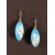 Turquoise vesica earrings with glow-in-the-dark harlequin squares