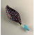 Curvy geometric coat pin in brick and teal